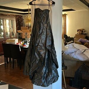 Beautiful greyish black dress. It is a stunner! Needs to be dry cleaned